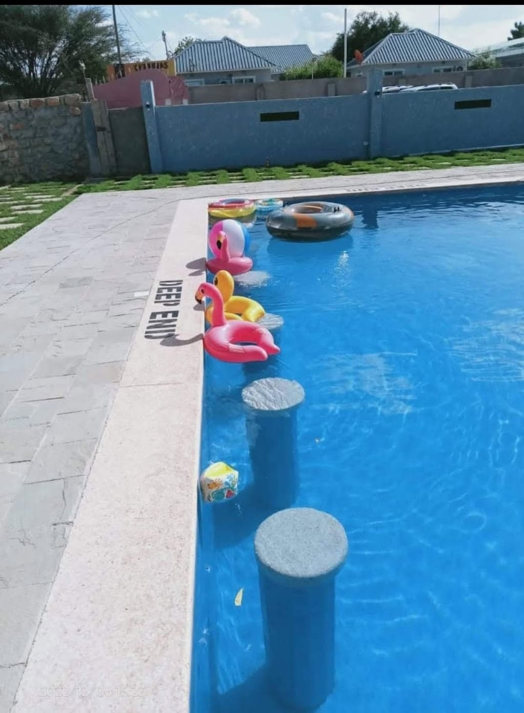 Inflatable flamingo floats in the pool at Cherinas Homes.